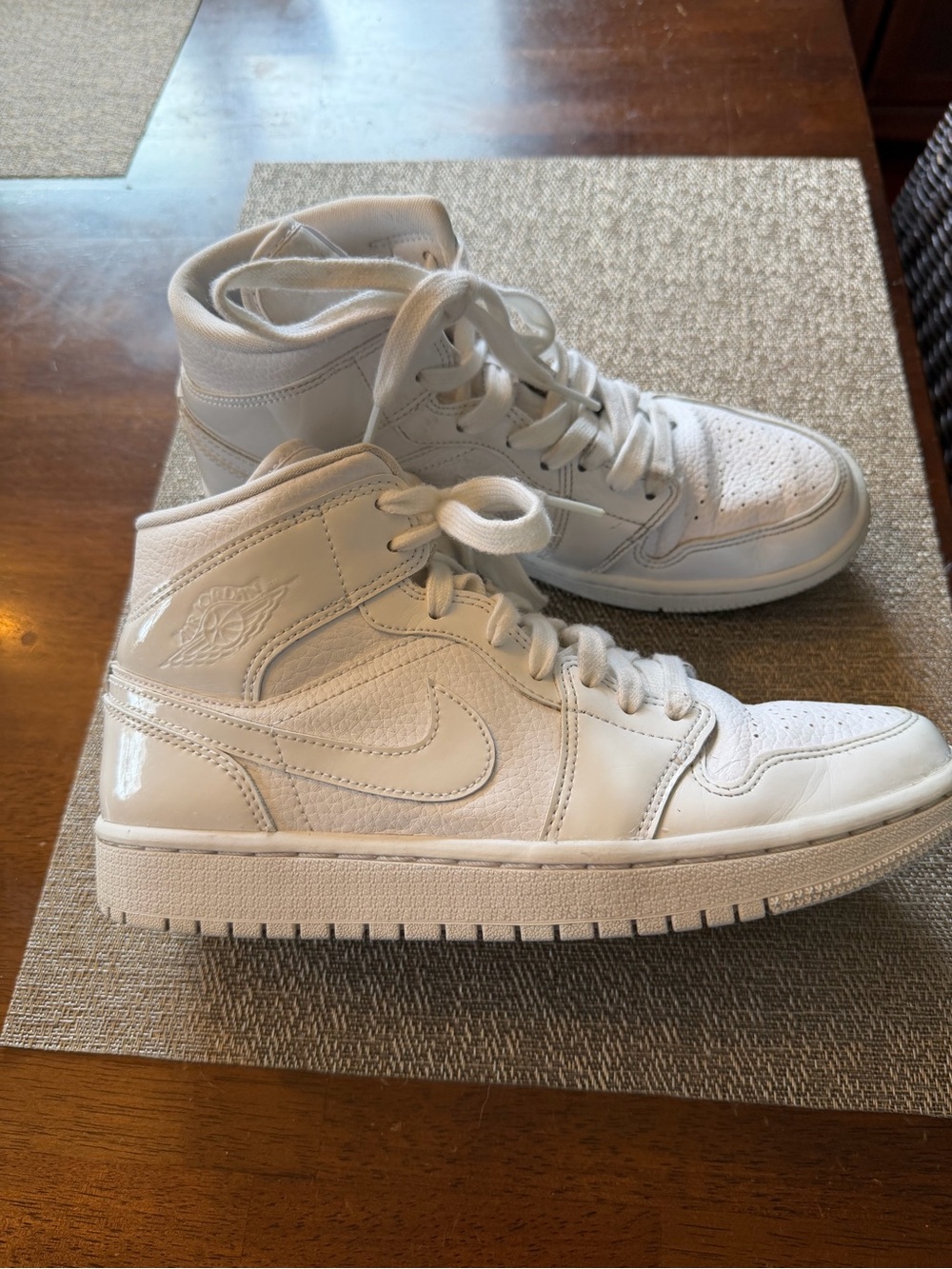 Women’s Nike Jordan 1 Triple white sneakers.